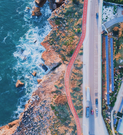 Aerial view of the coastal cycling path in Cascais beside the rocky Atlantic shoreline